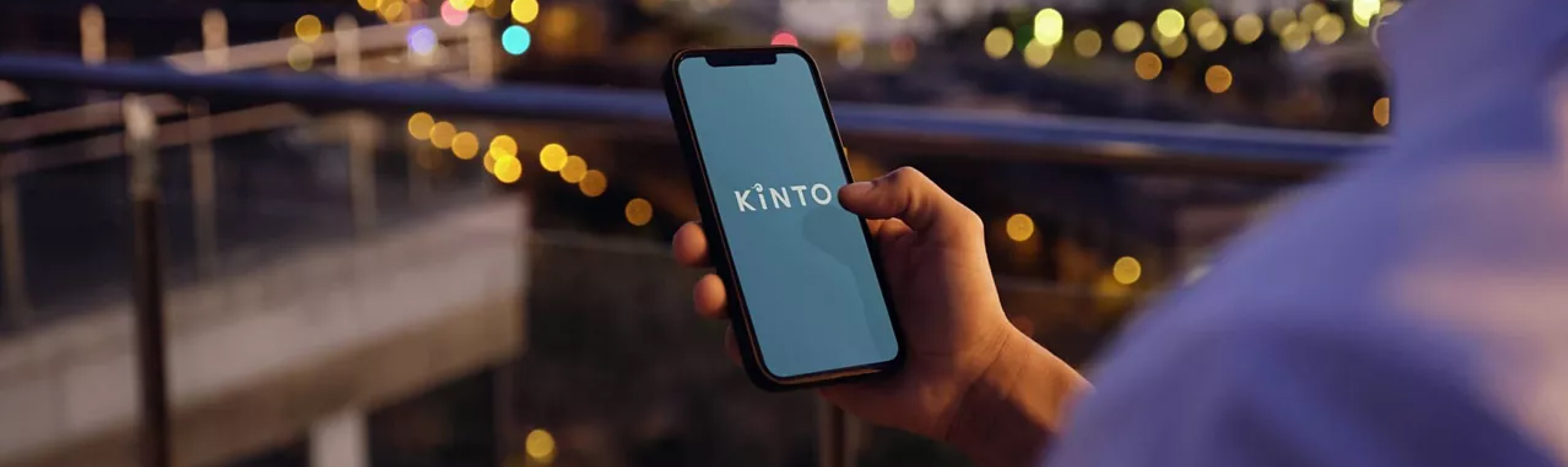 A person using the KINTO mobile application on their phone